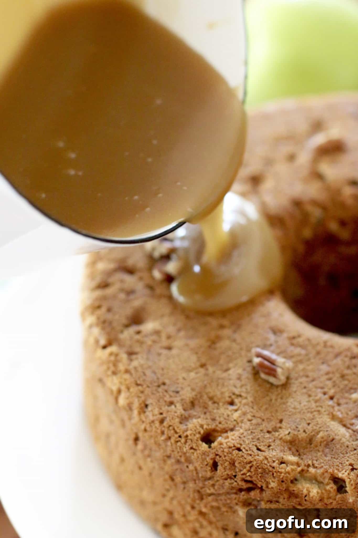 caramel glaze poured over apple cake.