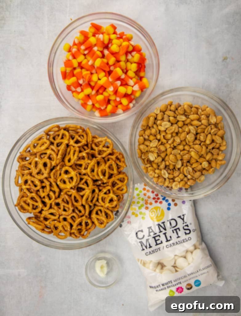 Trailer Park Terror Night 4 mini pretzel twists, candy corn, salted cocktail peanuts, Wilton bright white candy melts or white chocolate chips, vegetable shortening (Crisco).