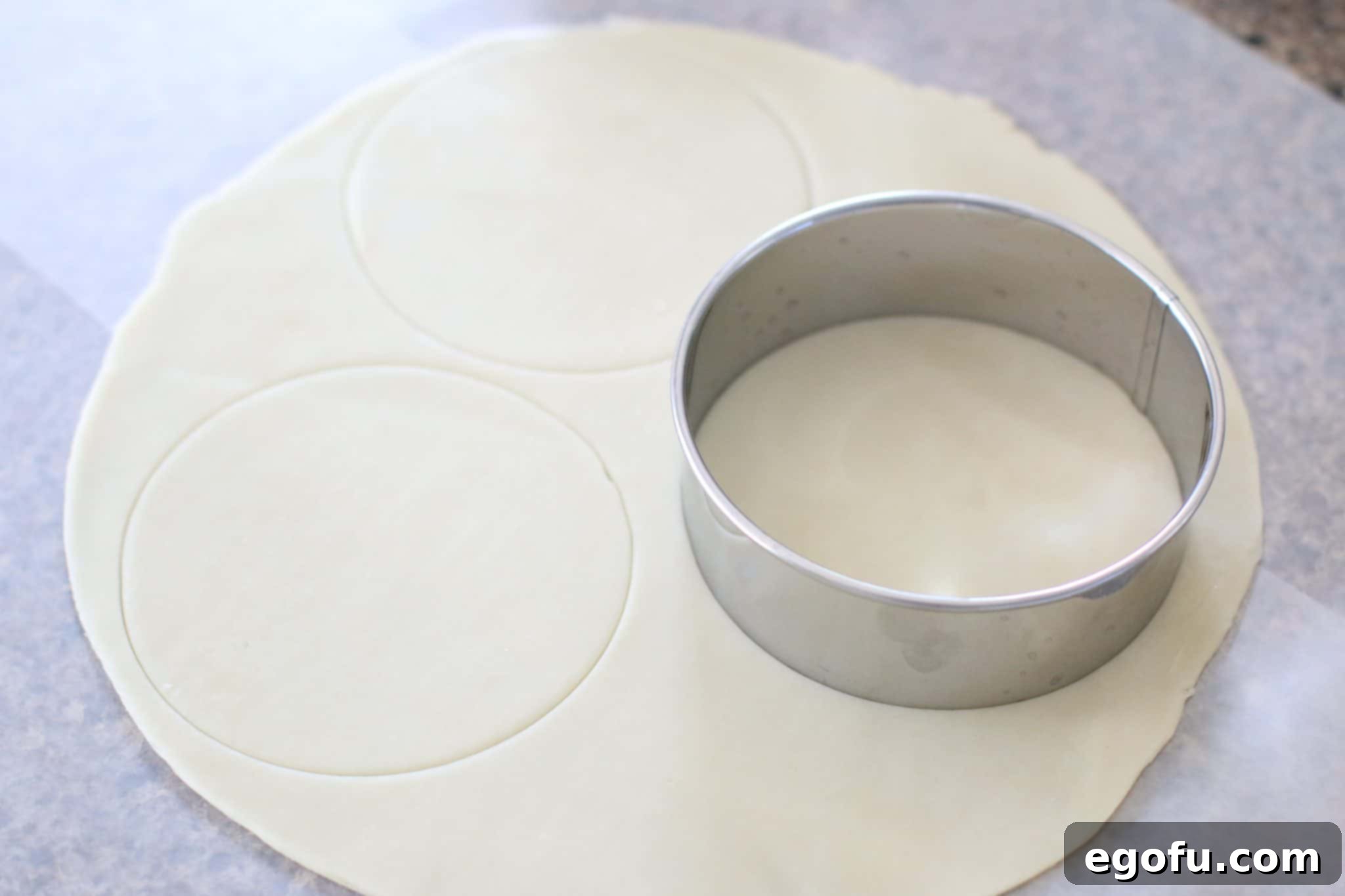 Cherry Cheesecake Minis 6 A Pampered Chef Large Pie Cutter is used to precisely cut round shapes from the refrigerated pie crusts for the mini pie bases.