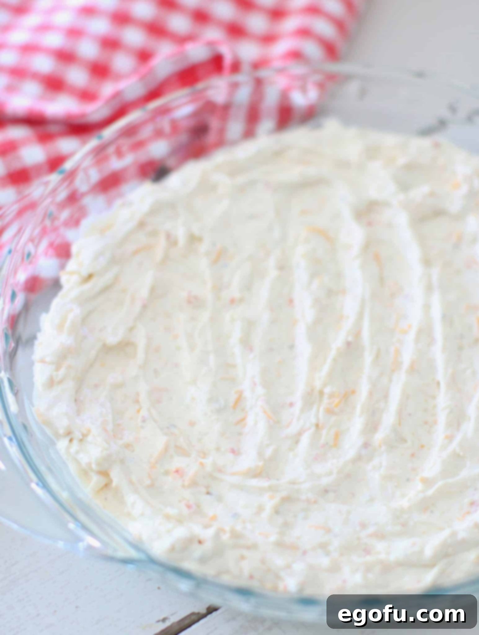 cream cheese dip spread into clear pie pan.