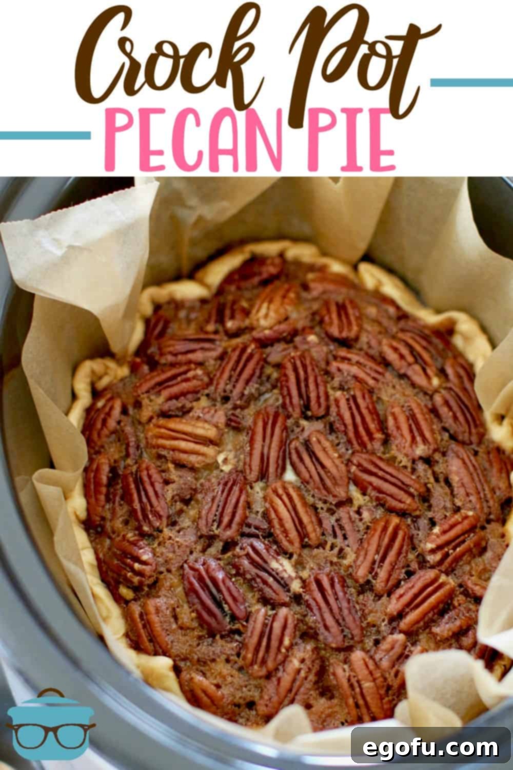 A whole, perfectly baked Slow Cooker Pecan Pie presented inside an oval slow cooker insert, ready to be sliced and served.