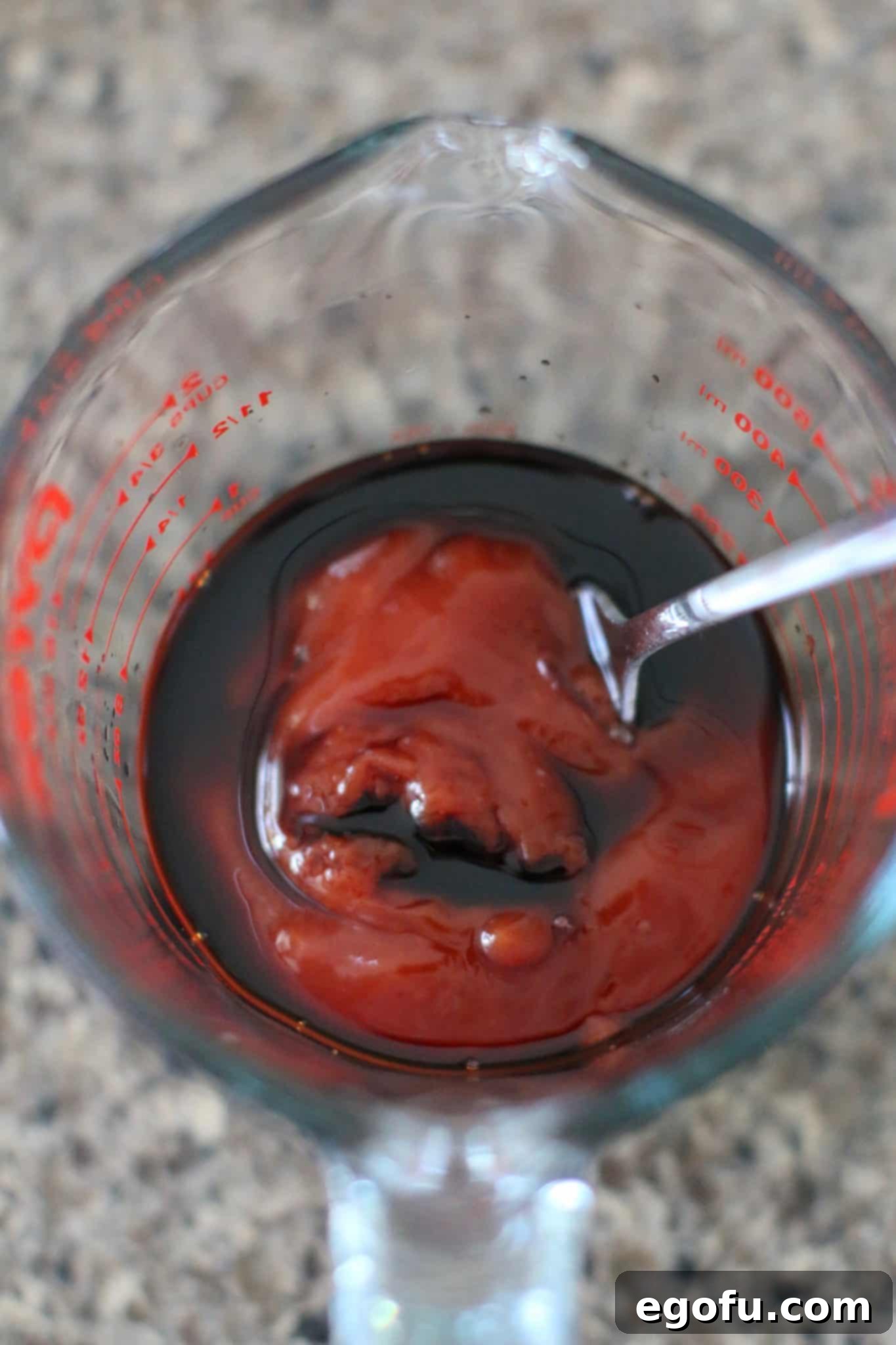 A small bowl containing ketchup and balsamic vinegar, mixed together to create the tangy meatloaf glaze.