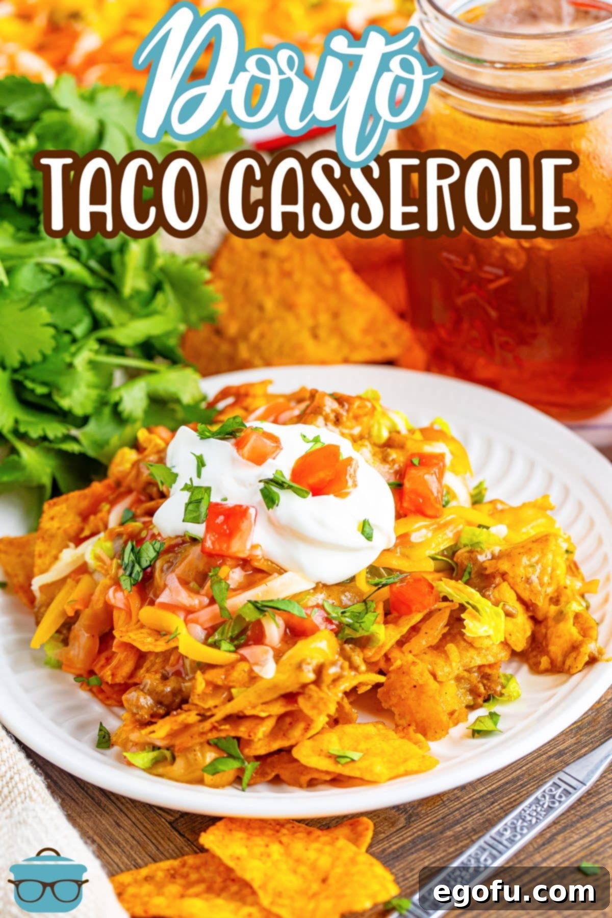 A white plate with a large serving of Dorito Taco Casserole.