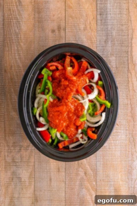 Marinara on top of peppers and onions.