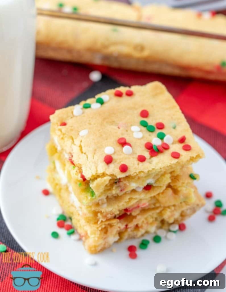 Christmas Blondie Bars stacked, showing off their festive colors and delicious texture.