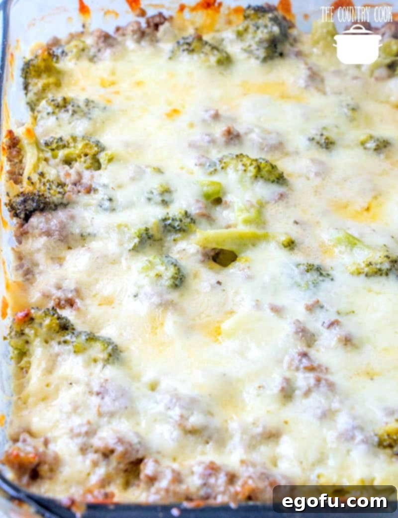 Melted mozzarella cheese on a bubbling low carb hamburger and broccoli casserole, fresh out of the oven.