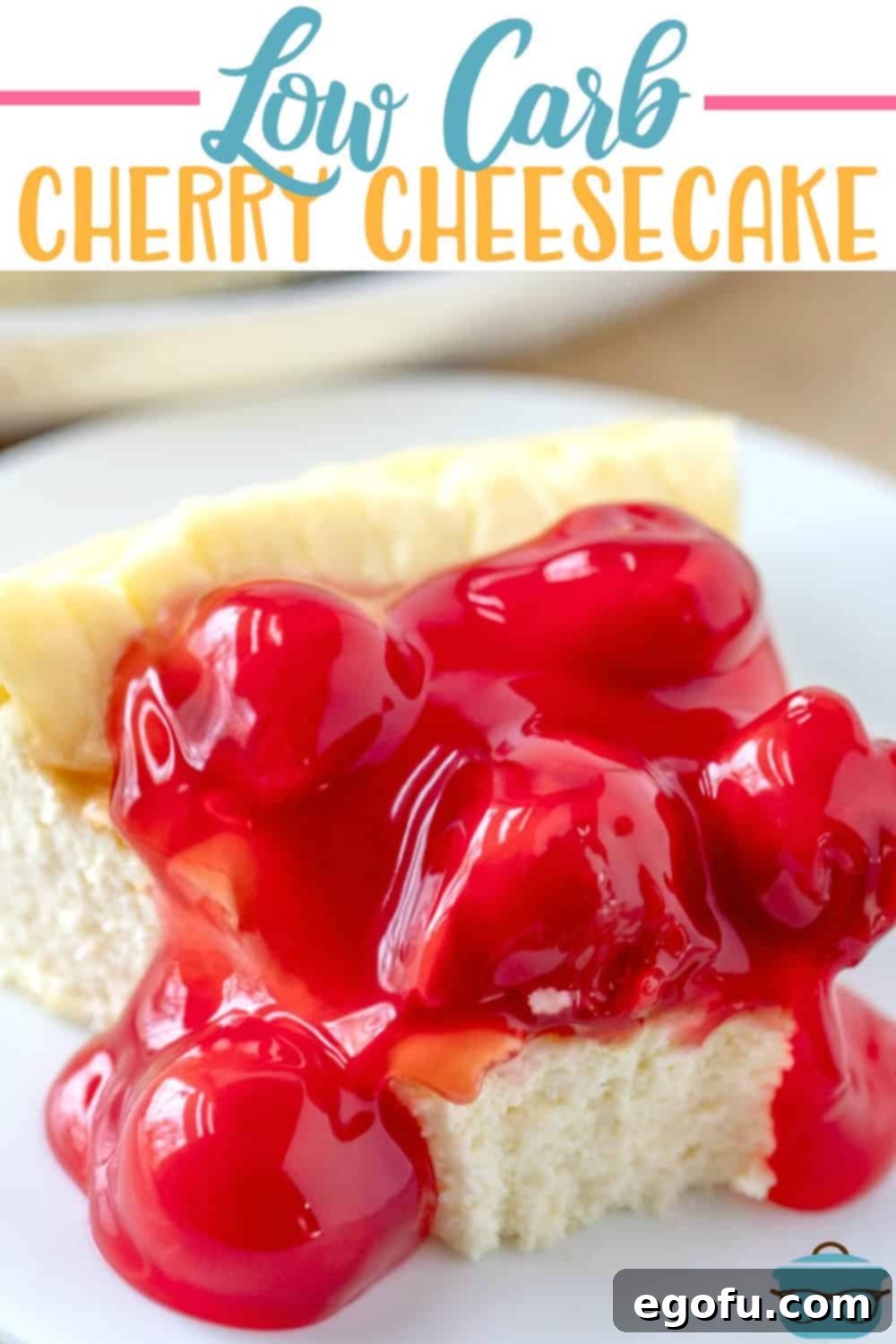 A delicious slice of low carb cherry cheesecake with a generous topping of sugar-free cherry pie filling.