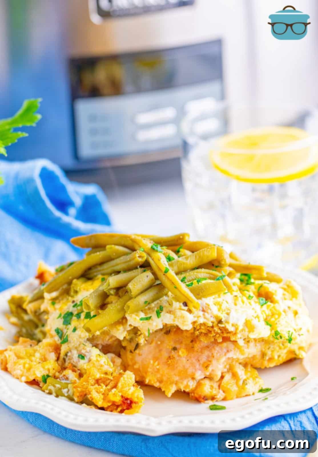 Crock pot chicken and stuffing shown on a white plate. 