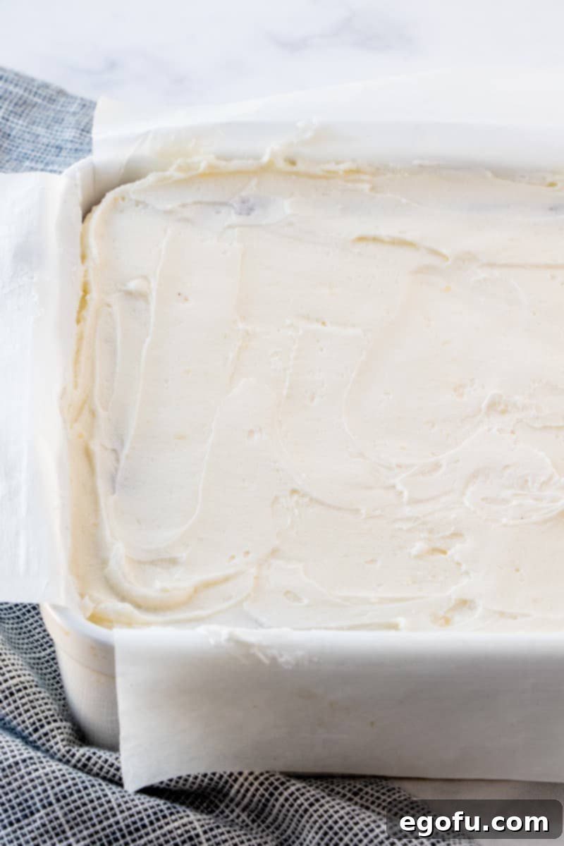 Velvet Red Dream Bars 9 thick buttercream frosting on top of red velvet baked cake mix.