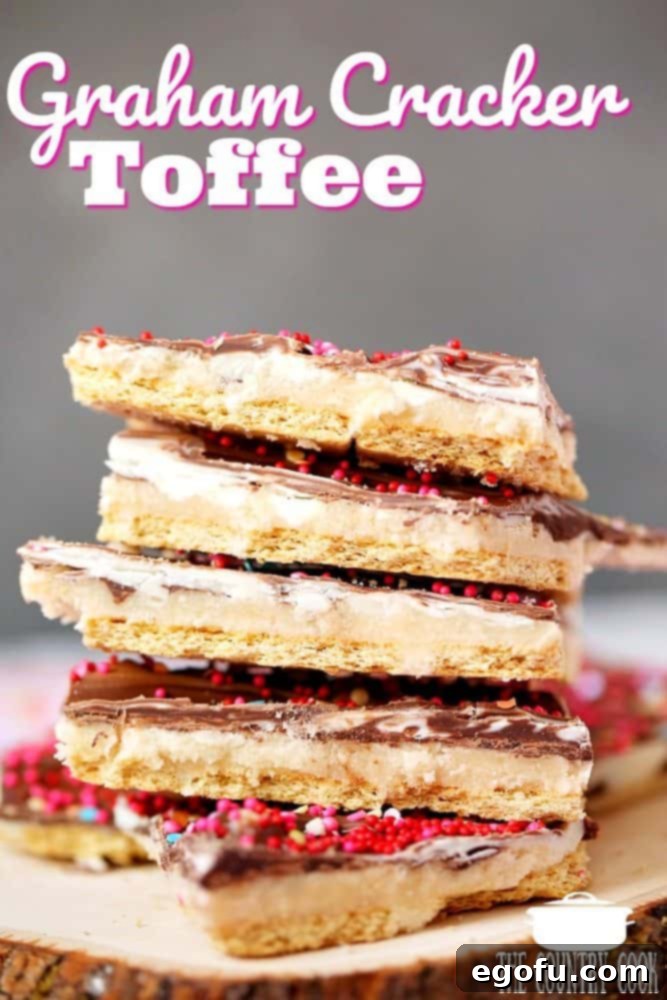 stacked pieces of graham cracker toffee shown on a wooden surface, 