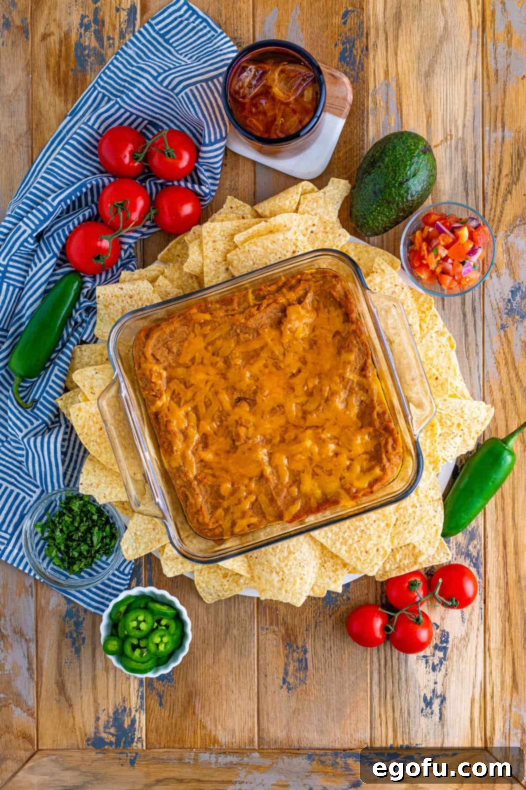 fully baked refried bean dip surrounded by tortilla chips.