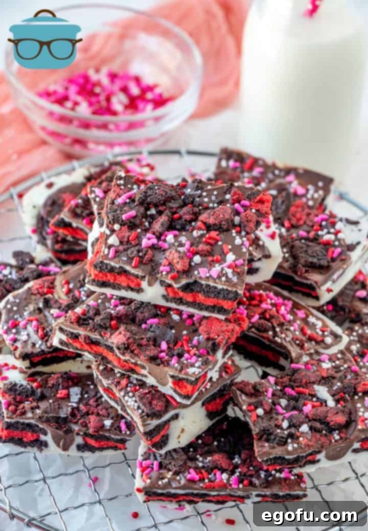 Cupids Oreo Bark 11 VALENTINE'S DAY OREO BARK, stacked in pieces on a round cooling rack.