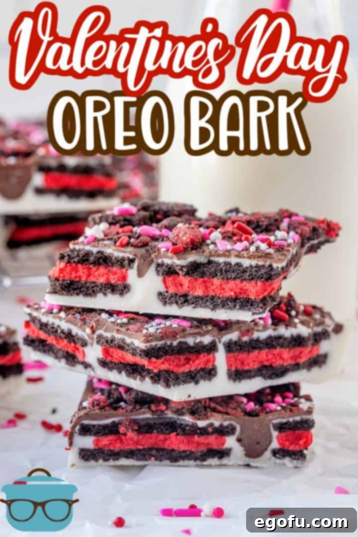 Cupids Oreo Bark 3 Valentine's Day Oreo Bark Recipe from The Country Cook, pictured are 3 pieces of Oreo cookie bark stacked on top of each other with a small glass bottle of milk in the background.