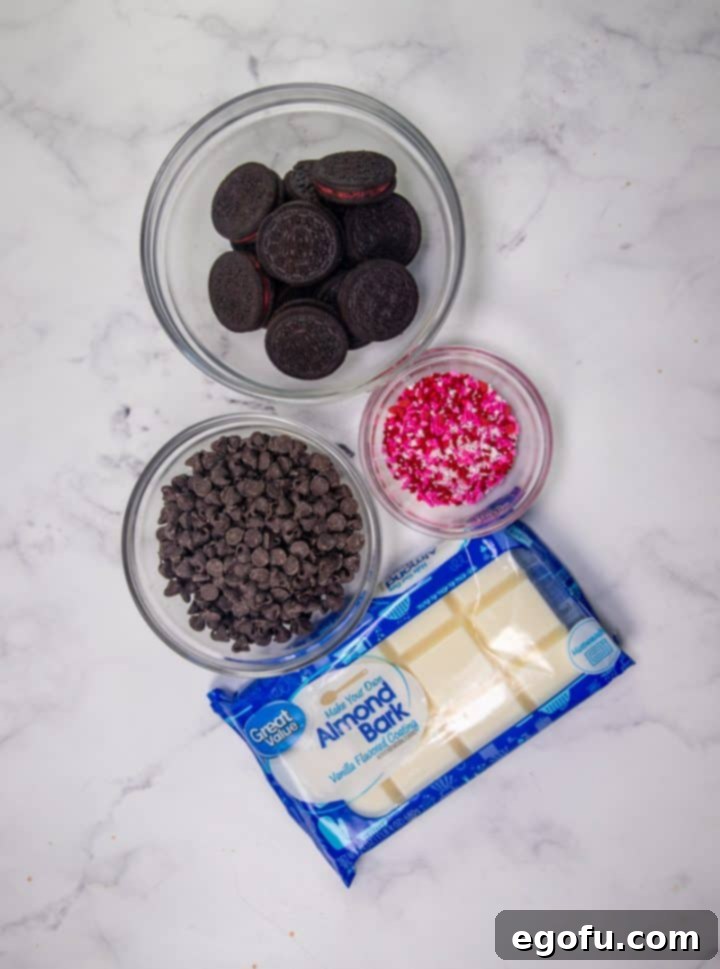 Cupids Oreo Bark 4 Oreo Bark ingredients: Oreo cookies, sprinkles, white chocolate, almond bark, chocolate chips.