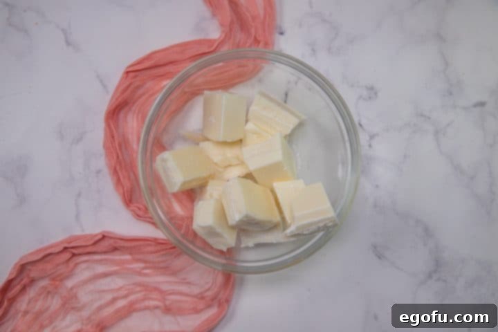Cupids Oreo Bark 5 melted vanilla almond bark in a bowl.