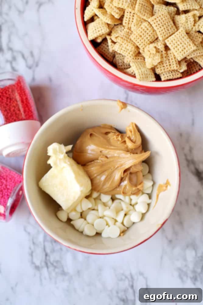 Butter, peanut butter, white chocolate chips in a bowl.