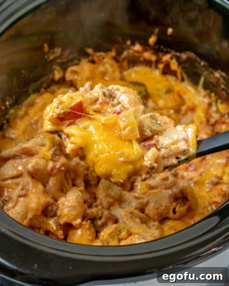 Final dish, Crock Pot Taco Pasta with melted cheese on top, ready to be served.