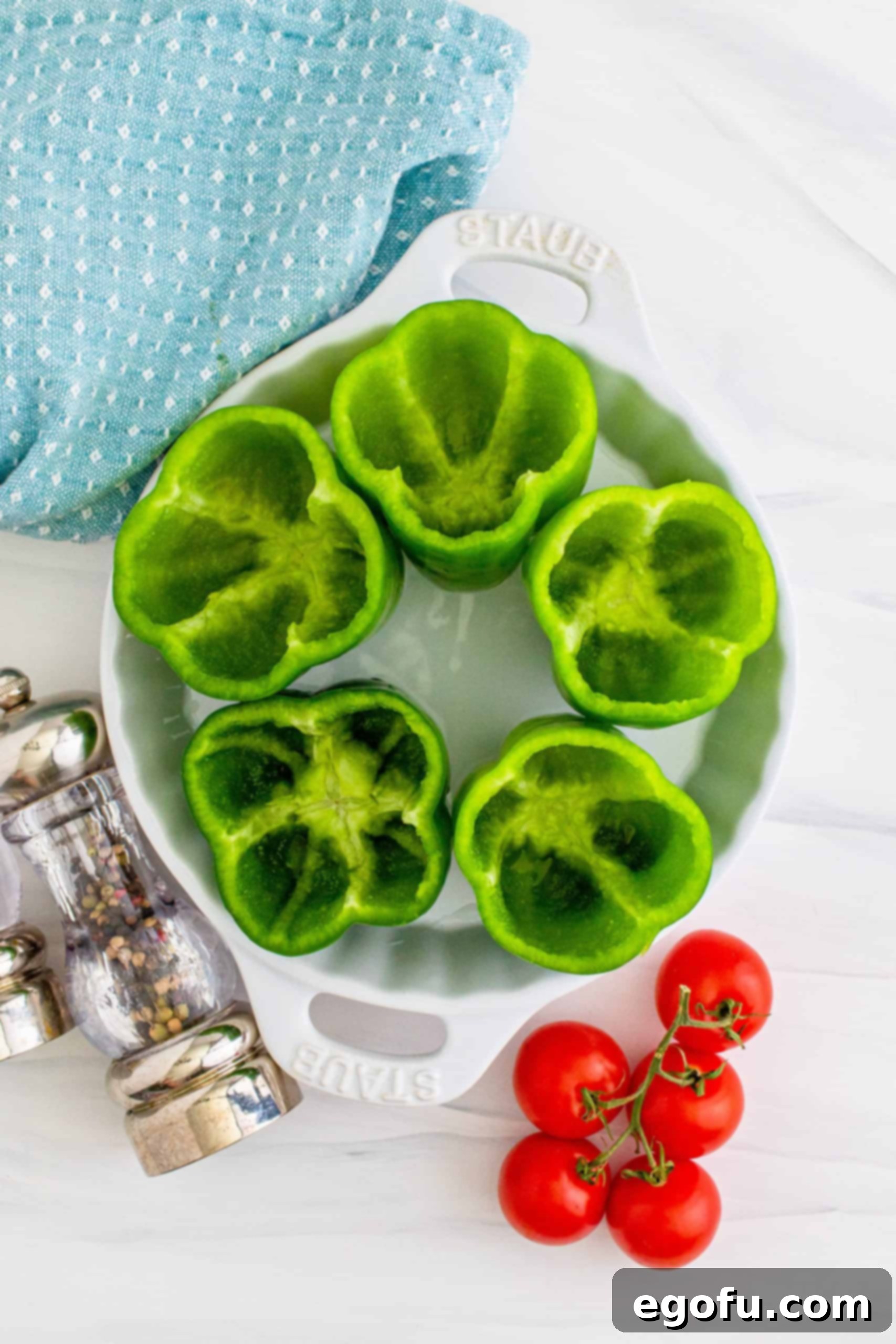 tops and insides removed from green bell peppers.