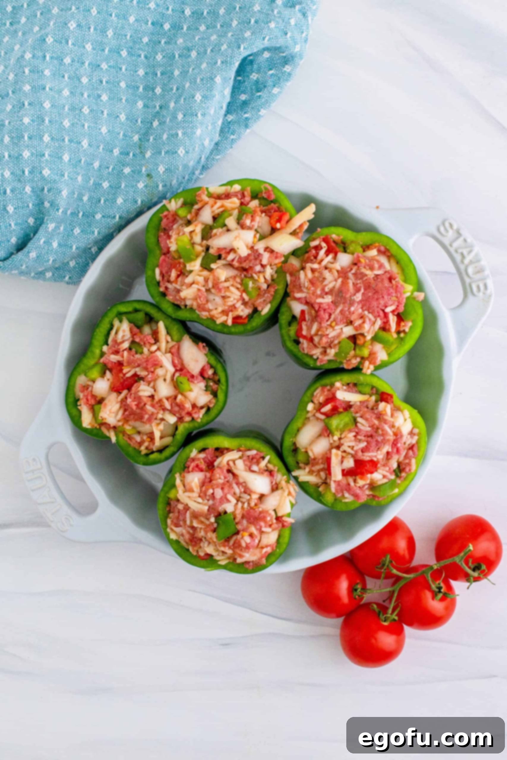stuffed pepper filling in five bell peppers .