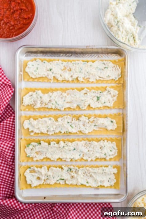 ricotta cheese mixture spread into the middle of all the lasagna noodles.