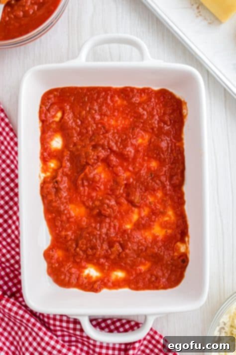 marinara spread on a baking dish.