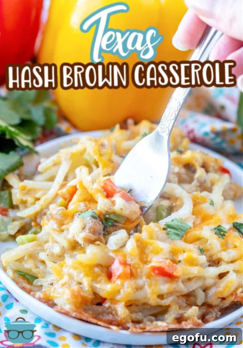 Lone Star Morning Spud Bake 3 A serving of Texas Hash Brown Casserole on a white plate, with a fork inserted, highlighting the rich colors and textures of the hash browns, cheese, and vegetables.