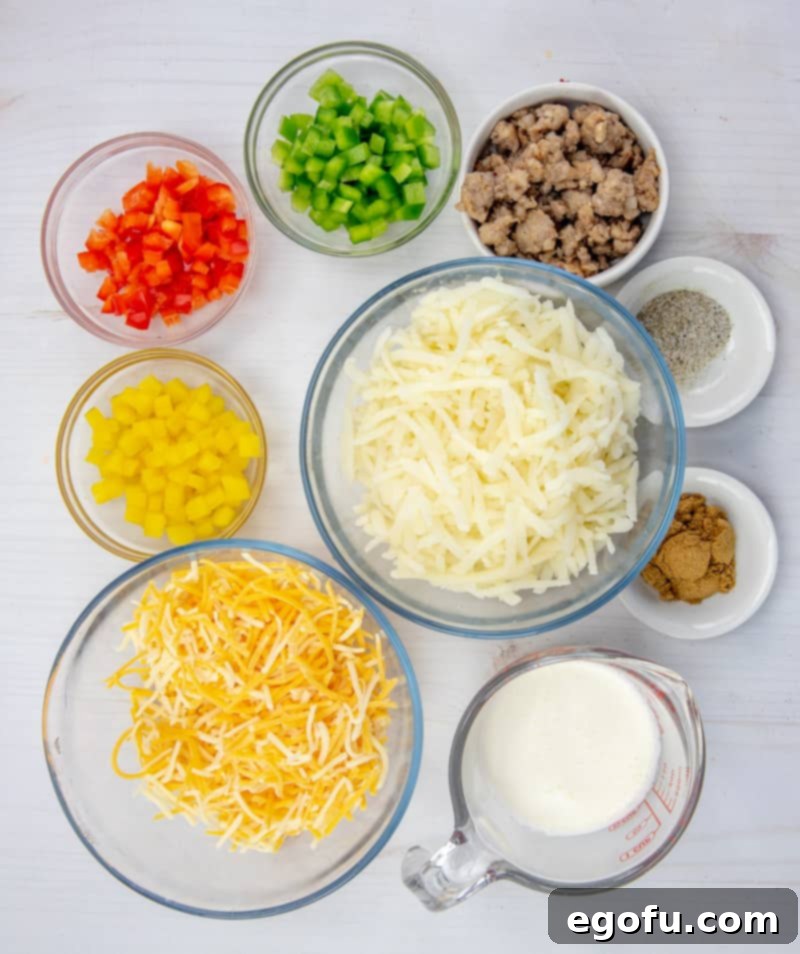 Lone Star Morning Spud Bake 4 A vibrant flat lay of all the fresh ingredients needed for Texas Breakfast Hash Brown Casserole: golden hash browns, chopped red, green, and yellow bell peppers, cooked crumbled sausage, shredded Mexican cheese, a bowl of heavy cream, and individual piles of cumin, salt, and pepper.
