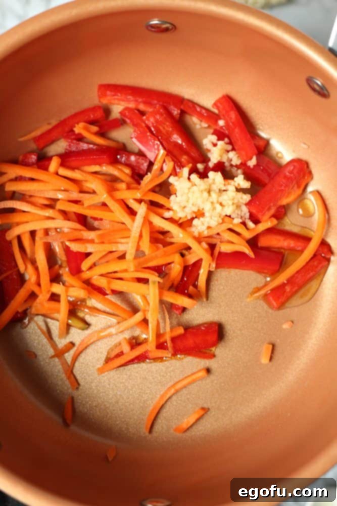 julienned carrots, sliced red peppers, garlic sautéed in sesame oil.