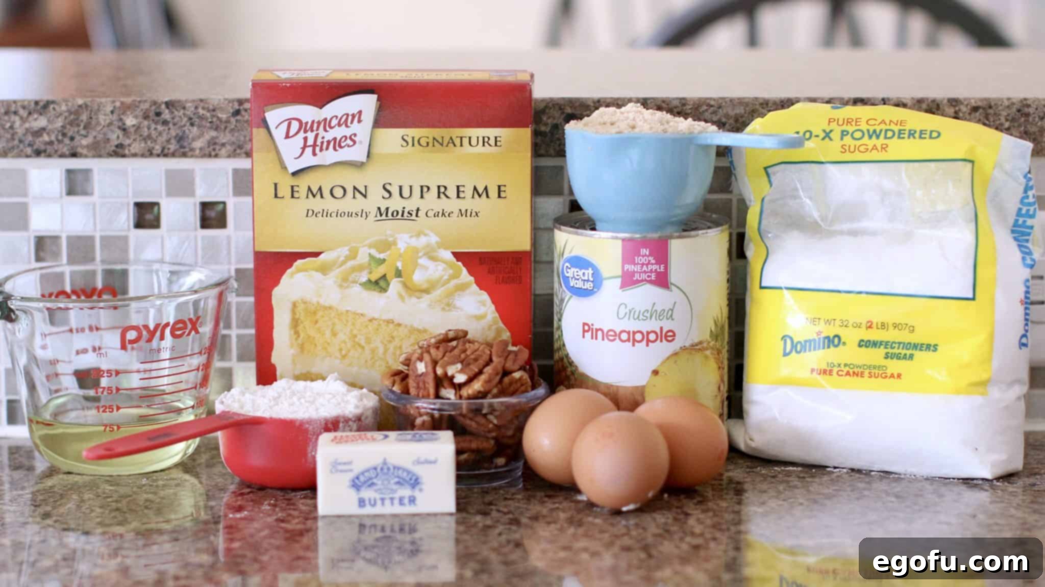 Sunshine Pineapple Crumb Cake 4 Lemon cake mix, crushed pineapple, brown sugar, eggs, butter, flour, powdered sugar, pecans - ingredients for Easy Pineapple Crumb Cake