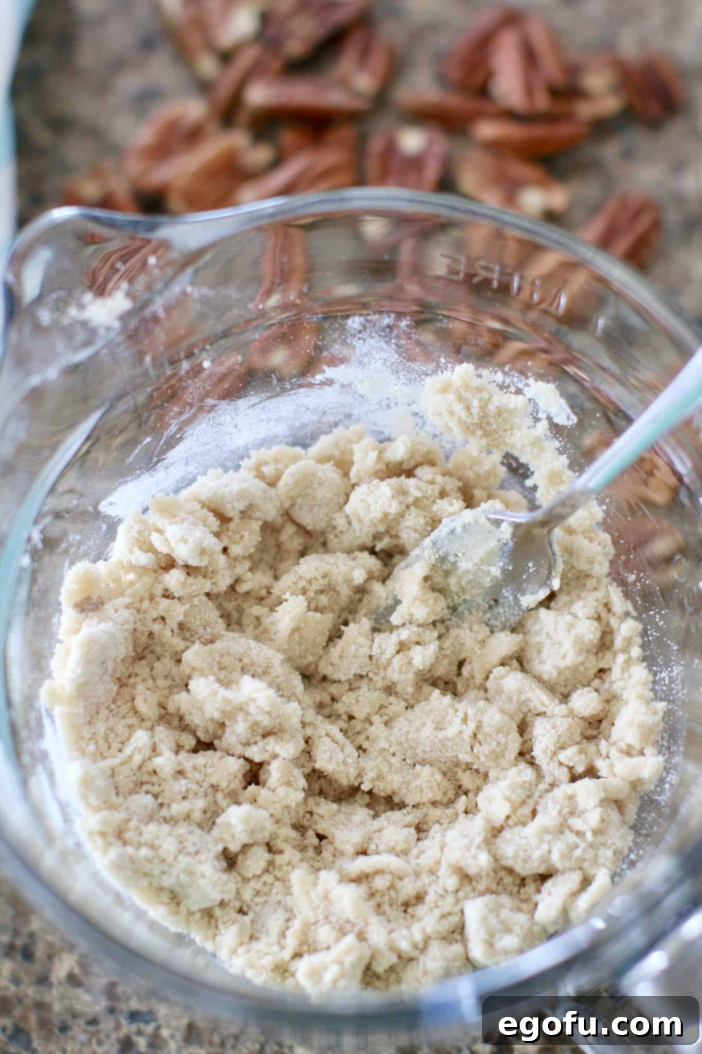 Sunshine Pineapple Crumb Cake 5 Brown sugar, flour and softened butter being combined to make crumb topping for pineapple cake