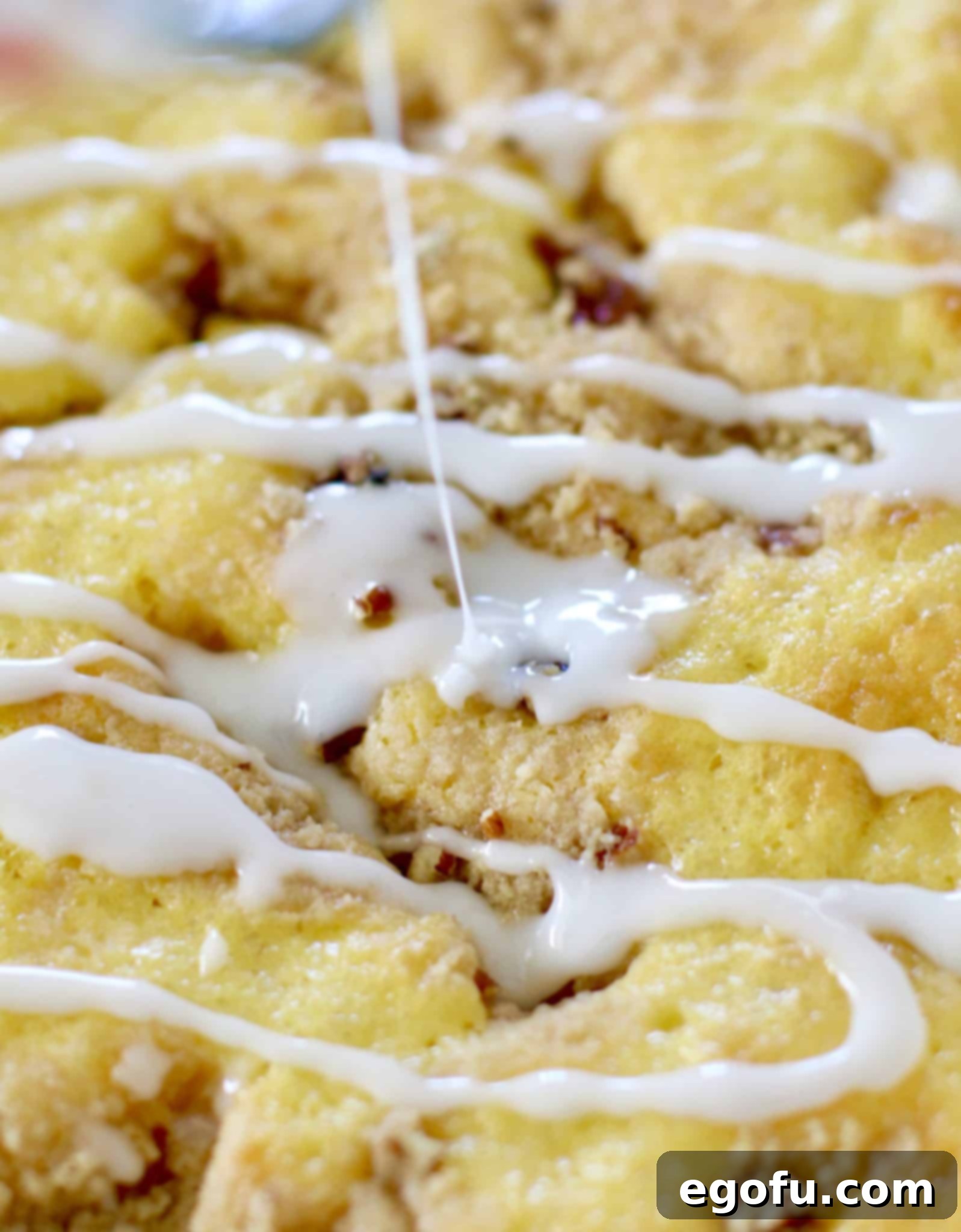 Sunshine Pineapple Crumb Cake 10 Drizzling pineapple icing on top of prepared pineapple crumb cake