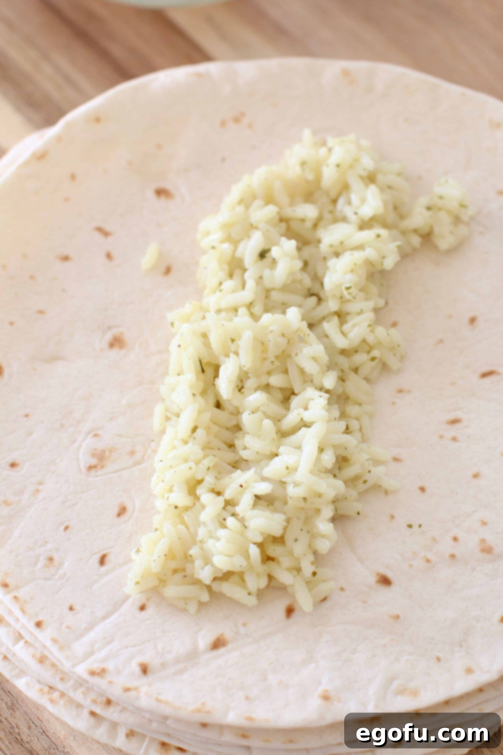 cilantro lime rice on top of flour tortilla.