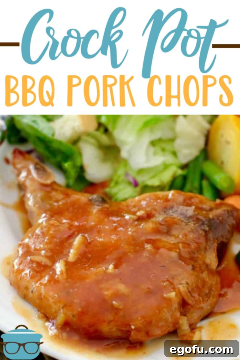 a whole pork chop with a BBQ glaze on top on a white plate with a salad in the background.