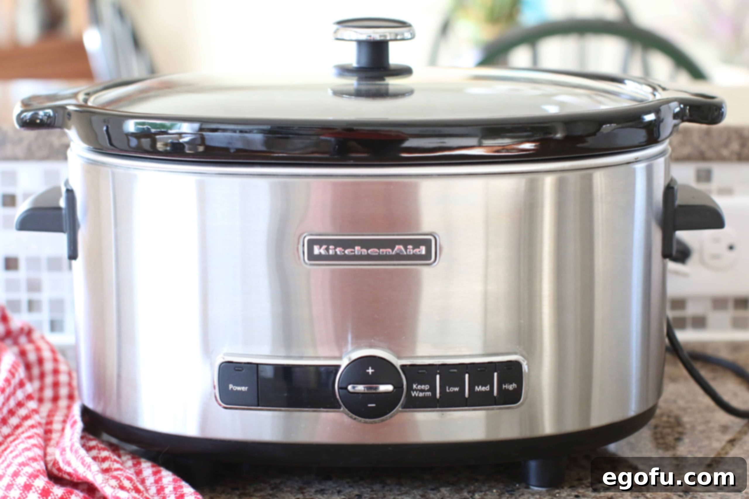covered KitchenAid 5-quart slow cooker shown on a kitchen counter.