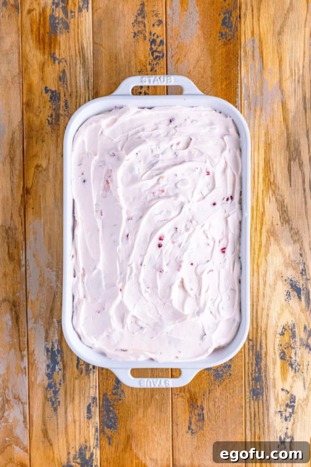 cherry whipped topping spread evenly on top of cake. 