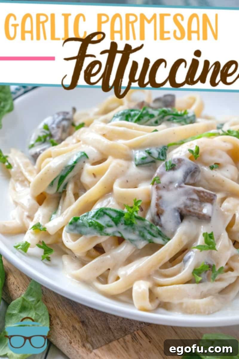 Creamy Garlic Parmesan Fettuccine Alfredo 3 Creamy Garlic Parmesan Fettuccine Alfredo shown on a small round white plate.