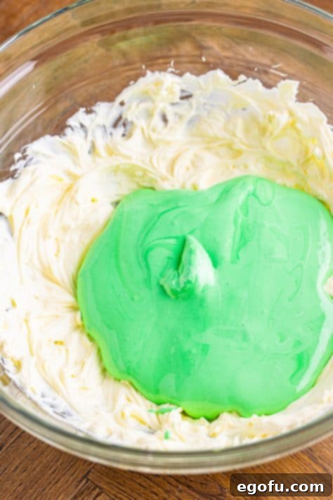 Whipped topping added to green cream cheese mixture.