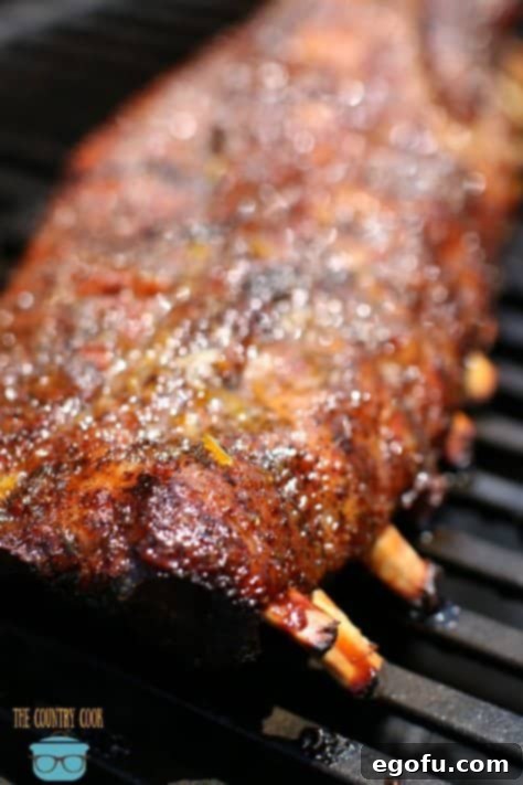 Pork Ribs on the gas grill covered with a glaze and finishing cooking.
