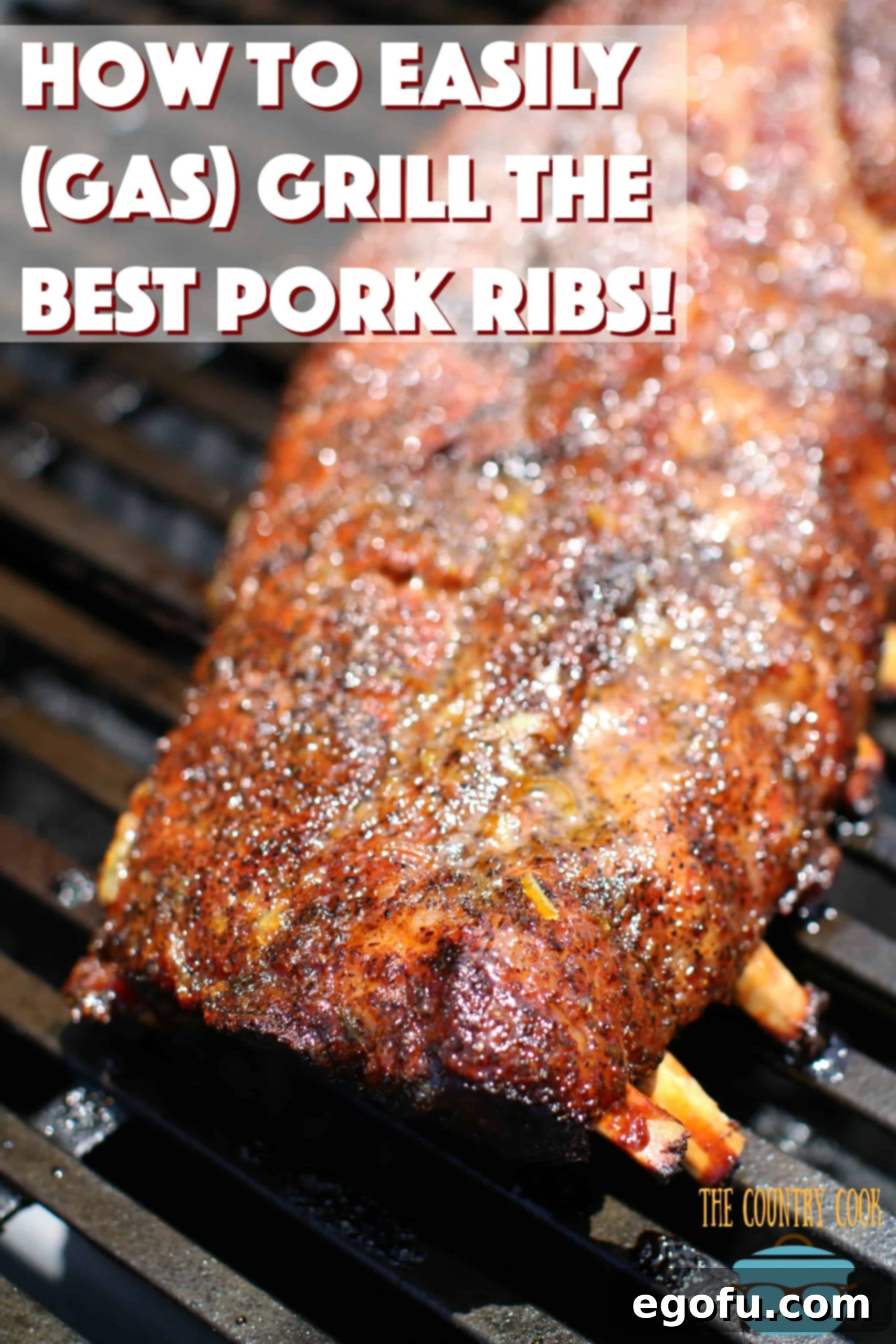 A full rack of perfectly cooked, glazed ribs resting on the gas grill grates, ready to be removed and served, showcasing a beautiful caramelized finish.