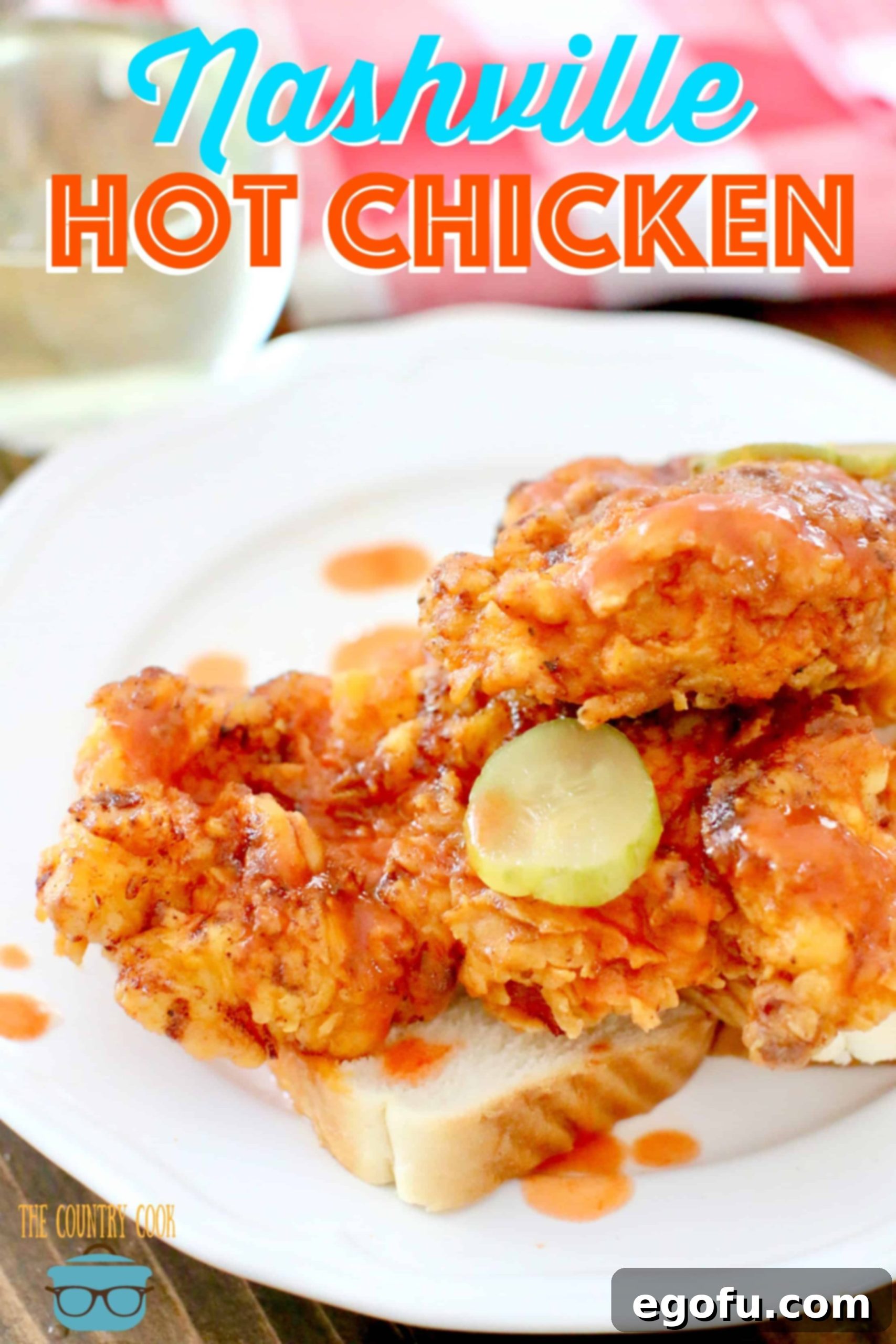 Mild Nashville Hot Chicken recipe from The Country Cook. Chicken pieces shown placed on white bread with sliced pickles on top, ready to serve.