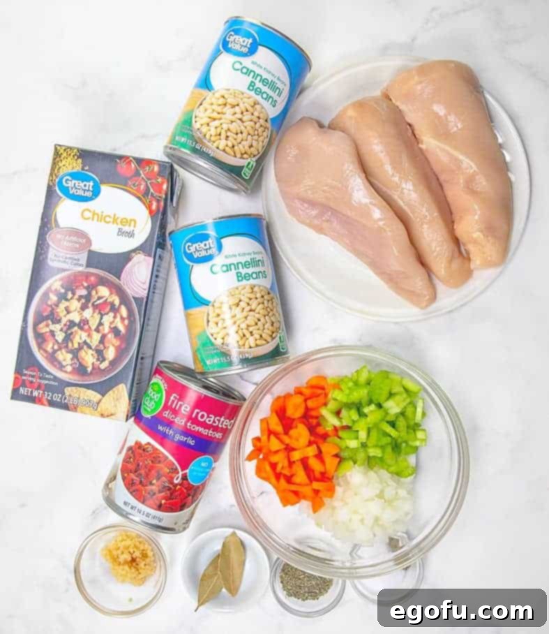 chicken breasts, diced celery, onion, carrots, chicken stock, cannellini beans, diced tomatoes, garlic, Italian seasoning, bay leaves and heavy cream.