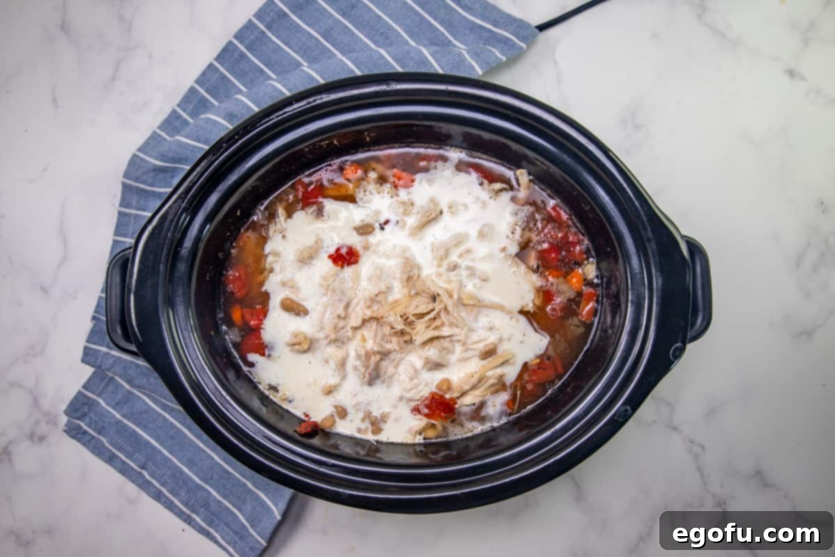 heavy cream added to Italian chicken soup in the crock pot.