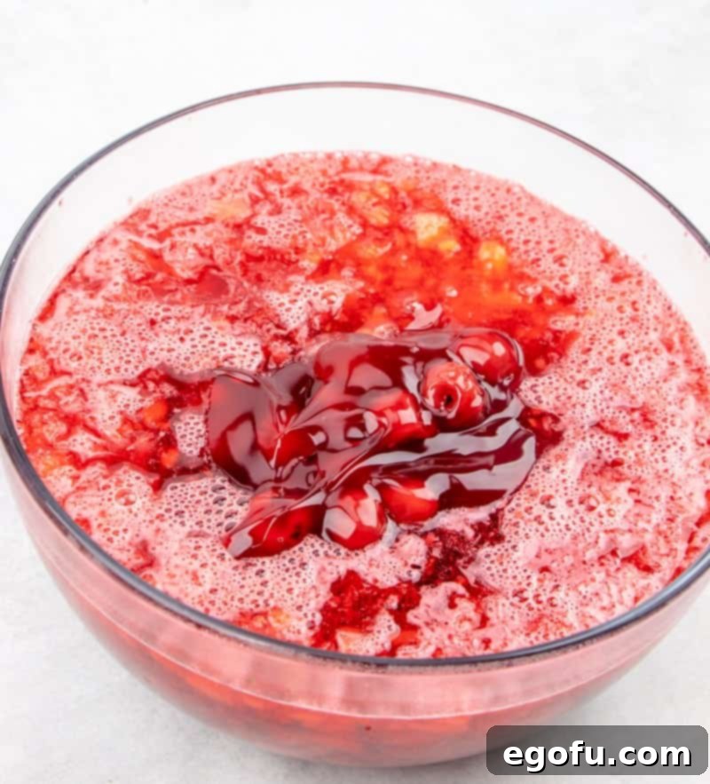 crushed pineapple and cherry pie filling added to cherry Jell-O