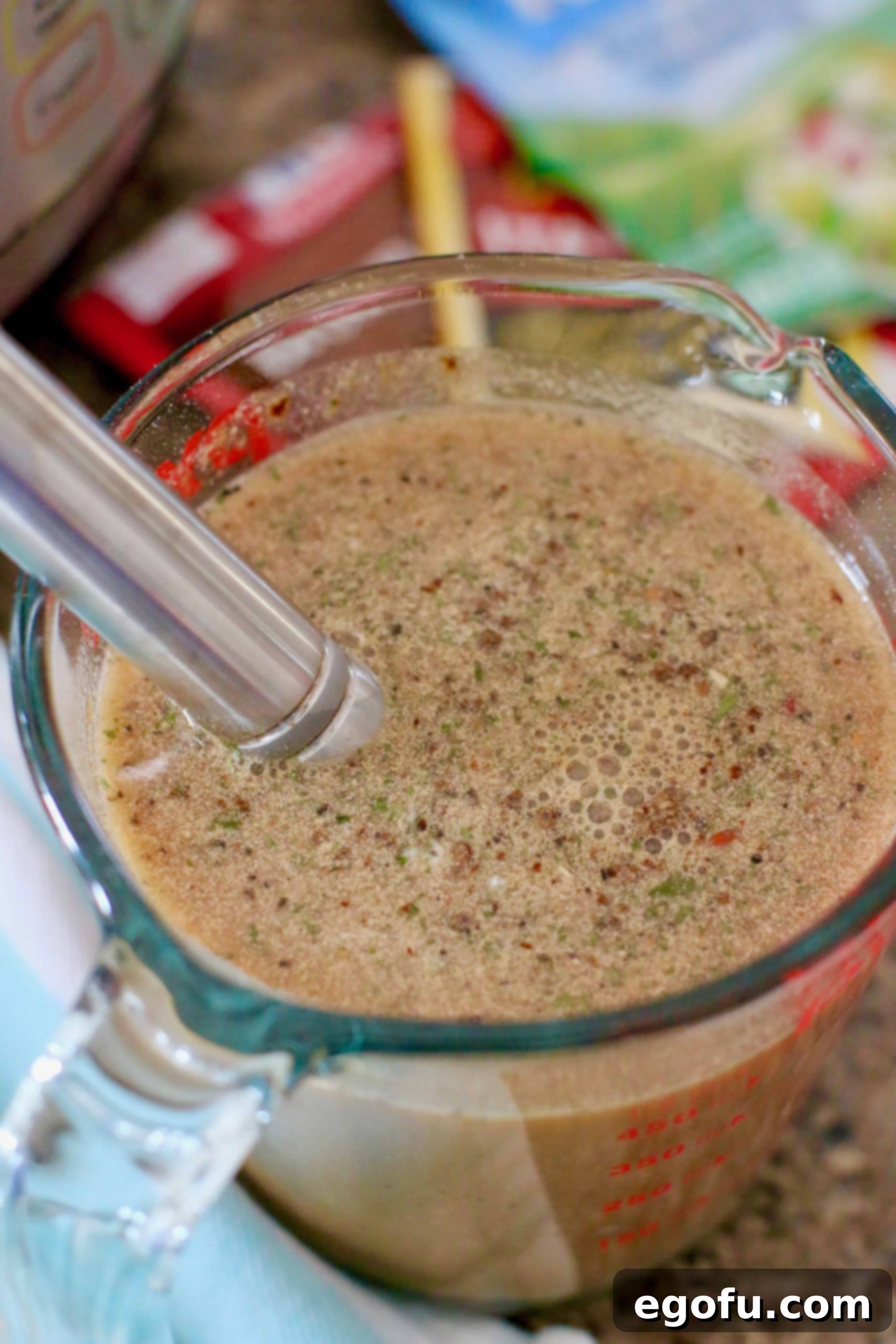 whisk together brown gravy mix, ranch dressing mix, Italian dressing mix and minced garlic.