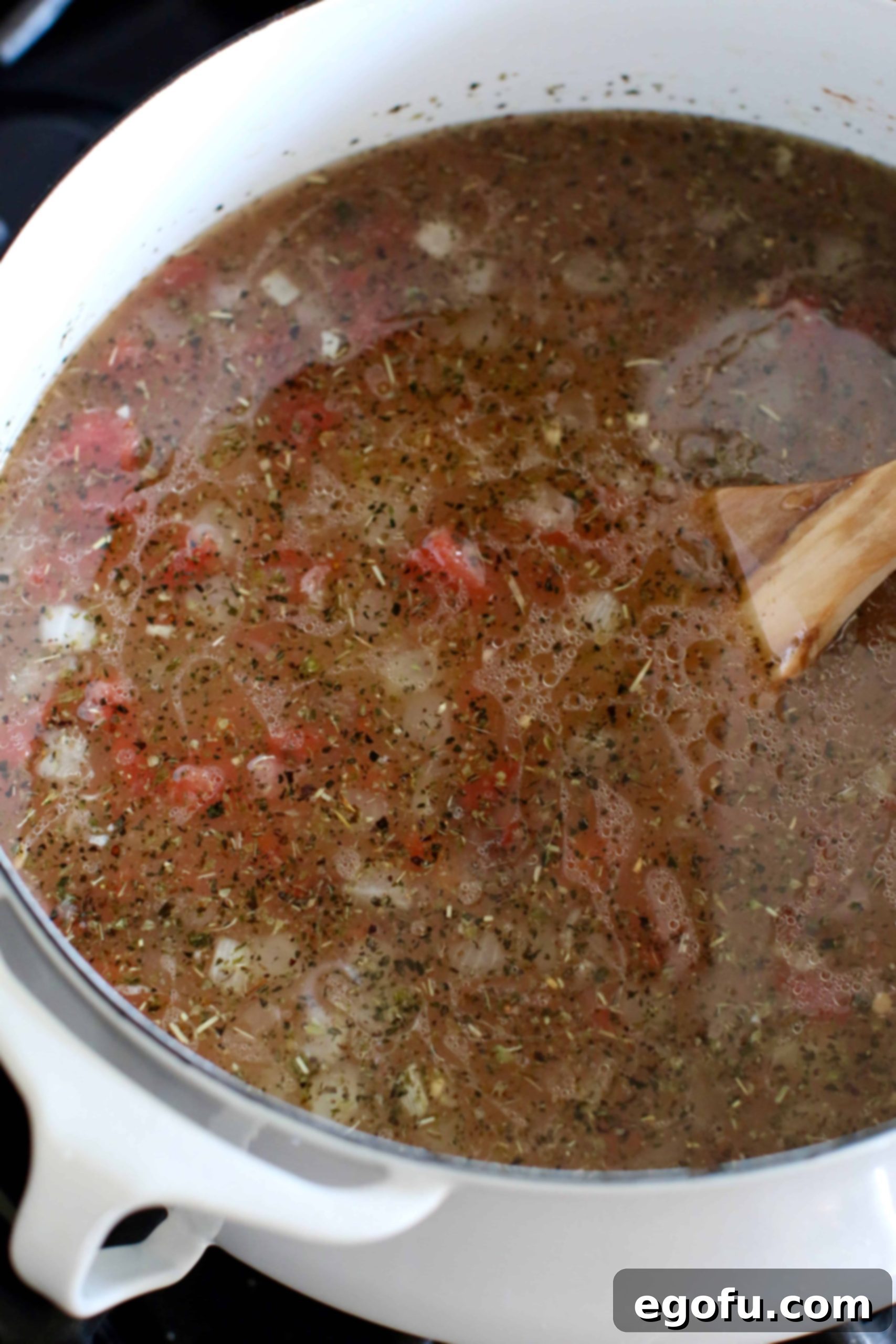 diced tomatoes, chicken bone broth and beans added to stock pot.