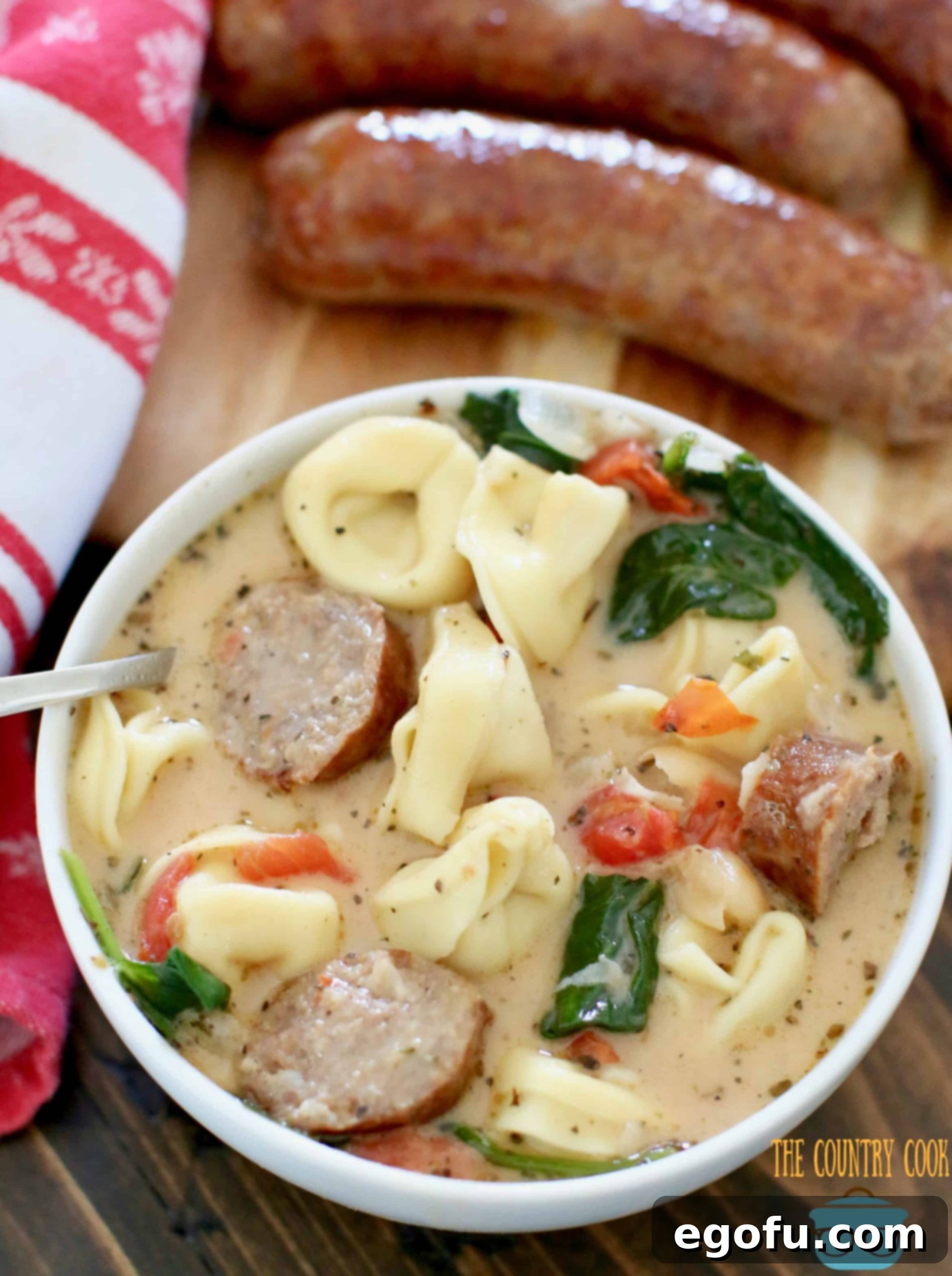 Creamy Tuscan Soup in a white bowl.