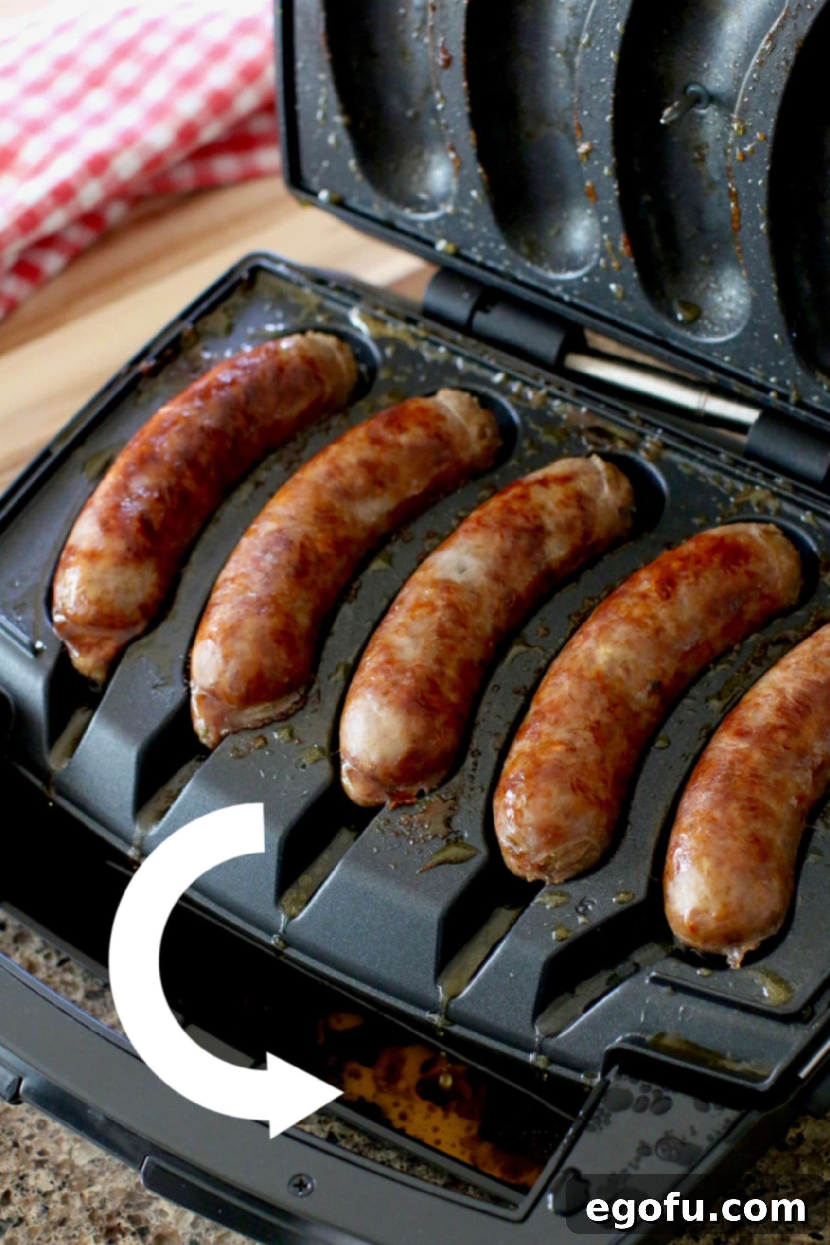 sausage grease dripping from trays of the sausage grill.