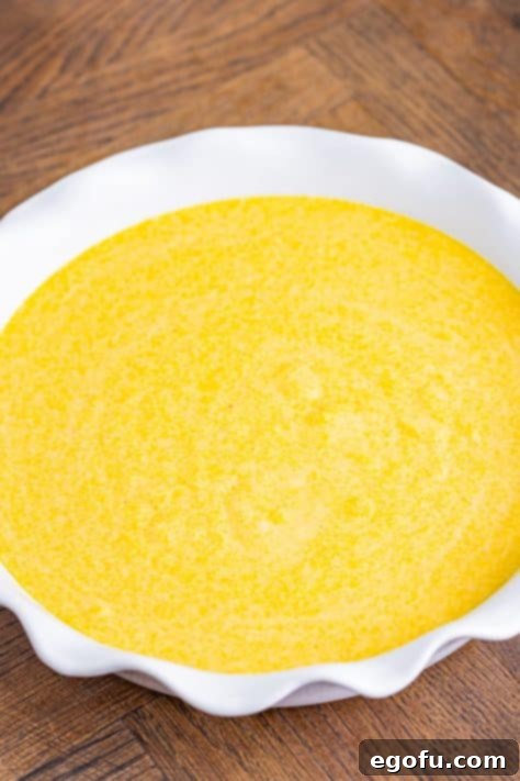 A pie plate with Sweet Cornbread batter.