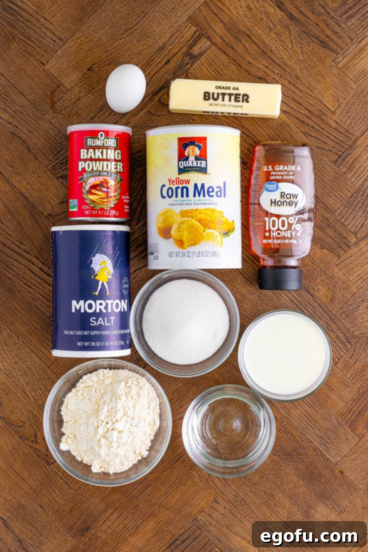 Corn meal, honey, sugar, salt, baking powder, water, egg, milk, and butter.