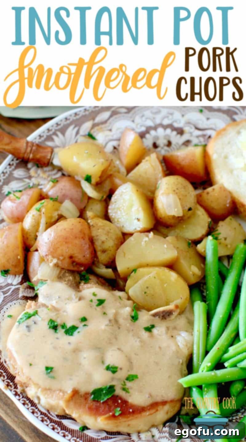 Instant Pot Smothered Pot Chops and Potatoes recipe from The Country Cook. Overhead photo of a pork chop covered in gravy on a plate with steamed potatoes and green beans.
